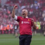 Arne Slot celebrates Liverpool winning the league