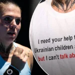 Mensagem da camiseta de Oleksandra Oliynykova para a Ucrânia após derrota no primeiro turno, coletiva de imprensa