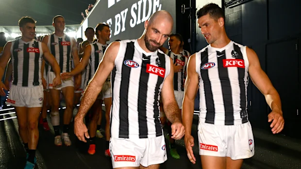 Steele Sidebottom e Scott Pendlebury dos Magpies.