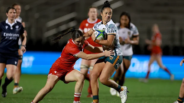 Nicole Ledington dos Wallaroos é abordada por Taylor Perry do Canadá.